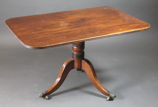A George IV rectangular mahogany breakfast table raised on a  turned column and tripod base, brass claw feet 48"w x 30"d x  28"h