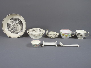 An 18th Century Creamware leaf shaped sauce boat 2.5", a Creamware knife rest, do. condiment spoon, ribbonware twin  handle bowl 3", an 18th Century teabowl saucer with transfer  decoration 5", miniature bowl and 2 pottery cabinet cups