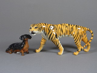 A Beswick figure of a seated Dalmatian 4" and do. walking tiger  8"