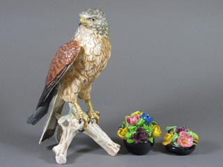 A Goebel figure of an eagle 9" and 2 floral posies 2" and 1"