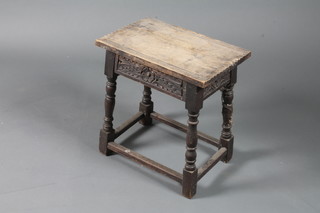 A 19th Century oak joyned stool having chip carved top above a rosette carved frieze, baluster turned supports on block feet 19"h  x 18"w x 12"d