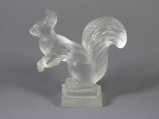 An Art Deco glass figure of a squirrel on a square base 5"
