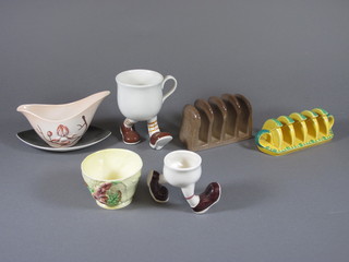 A Carltonware egg cup in the form of a jogging figure 1", do.  mug, 2 toast racks in the form of slices of lemon and Hovis   brown bread, sauce boat and a yellow Australian pattern bowl 3"