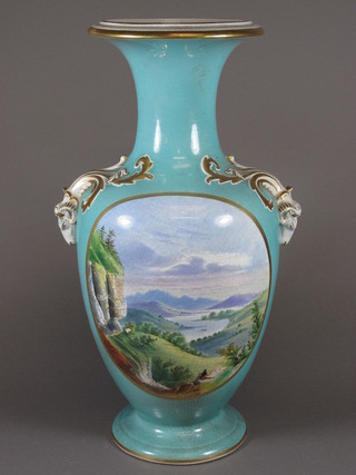 A turquoise glazed porcelain twin handled vase decorated a landscape 16.5"