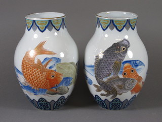 A pair of Oriental vases decorated Carp, the base with 3  character mark 10"