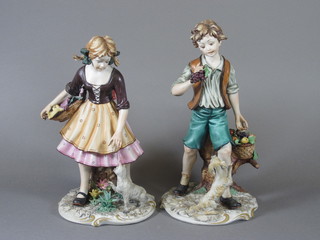 A pair of Capo di Monte biscuit porcelain figures of standing boy and girl 11"