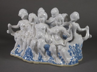 A Selsey Island Pottery soap dish decorated figures of cherubs 8"