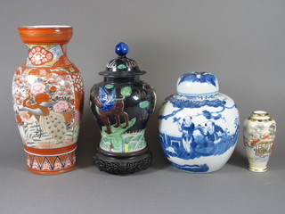 An Oriental blue and white ginger jar and cover 8", a Kutani  vase the base with 3 character mark 12", an Oriental urn and  cover the base with seal mark 7.5" and a late Satsuma vase 5"