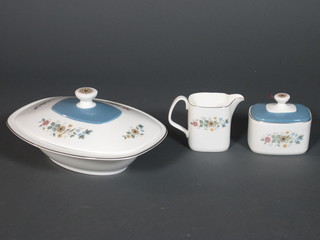 A 70 piece Royal Doulton Pastorale pattern dinner service  comprising 14" oval plate, 2 tureens and covers 11", sauce boat  and stand, 6 dinner plates 11", 6 breakfast plates 8", 12 side  plates 6" - 1f, 6 pudding bowls 7", 6 dessert bowls 5.5", circular  bread plate 9.5", 6 cups, 6 saucers, 6 coffee cans, 6 saucers,  milk jug, sugar bowl, teapot and cosy 6", coffee pot, cream jug  and sucrier