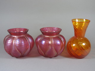 After Palme Konig, a pair of iridescent cranberry glass vases of globular form 7" together with a Whitefriars? orange glass vase
