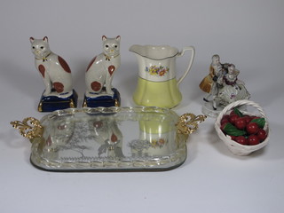 An etched glass twin handled tea tray, a pair of Staffordshire  style cats and other figures of cats