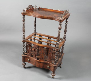 A mid Victorian figured walnut serpentine what-not Canterbury, having galleried top above 3 divisions and drawer to base, raised  on toupee legs with brass caps and casters 39"h x 22"w x 16"d