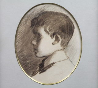 An early 20th Century British School, a monochrome  watercolour and pencil profile portrait of a young boy, feined to  oval 8"h x 6"w