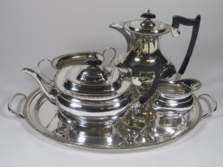 A 5 piece oval silver plated tea service comprising teapot, hot water jug, sugar bowl, cream jug and an oval silver plated twin handled tea tray
