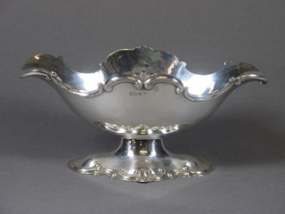 An Edwardian silver double spouted sauce boat, raised on an oval foot, Sheffield 1905 by Walker & Hall 4.5 ozs
