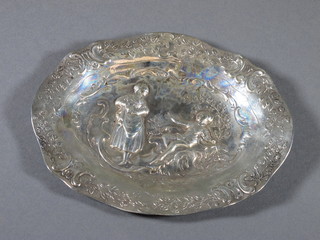 A Continental oval embossed silver sweet meat dish decorated  a lady and gentleman, 3 ozs