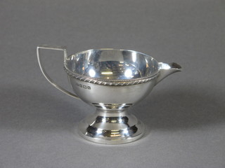 A silver cream jug raised on a circular spreading foot by George Unite 3 ozs