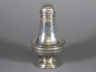Omar Ramsden, an Arts & Crafts planished silver sugar caster of baluster form raised on a circular spreading foot, the top  inscribed December 31st 1891 - December 31st 1916, London  1916 by Omar Ramsden 7 ozs, 6.5"h, makers mark for Ramsden and Carr    ILLUSTRATED