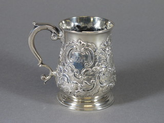 A Georgian silver tankard with later embossing, London 1787, 6ozs