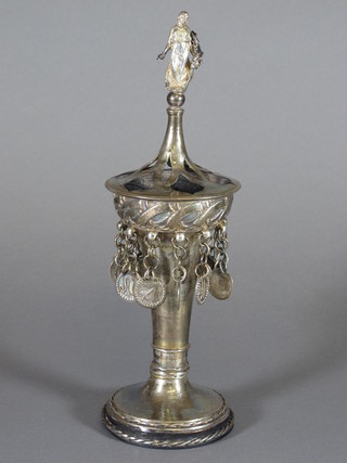 Omar Ramsden, an Arts & Crafts waisted silver cup and cover  with figural terminal, hung 11 circular pendants representing the  signs of the Zodiac, Pisces missing, raised on a spreading foot,  London 1904 by Omar Ramsden, 9 ozs, 11.5"h, makers mark for Ramsden and Carr    ILLUSTRATED