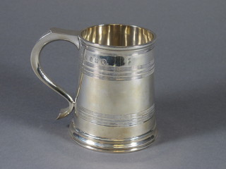 A George III style Britannia standard silver mug , hallmarked London 1935, makers mark B&C 11 ozs,