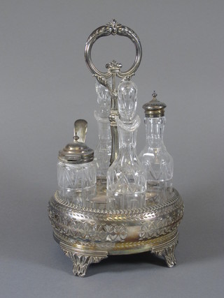 An oval pierced silver plated 4 bottle cruet with glass bottles