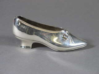 An Edwardian silver pin cushion in the form of a lady's shoe 2  ozs, cushion missing