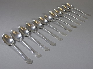 12 Continental Art Nouveau silver picture back spoons, 9 ozs