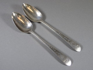 A pair of Georgian silver Old English pattern table spoons with  bright cut decoration Dublin 1771, makers mark L&B 4ozs