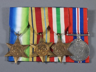 A group of 4 medals comprising Atlantic Star, Africa Star, Italy Star and British War medal, court mounted