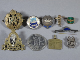 A George VI Royal Canadian Signal Corps cap badge, an RAF  cap badge, a facsimile coin, a Merchant Navy lapel badge etc