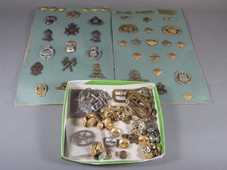 An Indian Army Ordnance Corps shoulder title and a collection  of buttons and badges