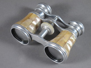 A pair of mother of pearl and chrome opera glasses by Dolland