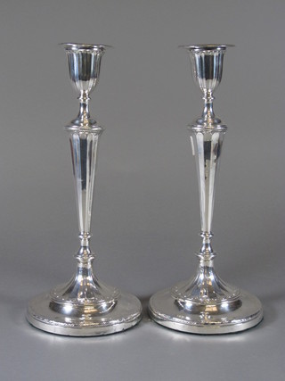 A pair of George III silver candle sticks with detachable sconces, Sheffield 1797 12" high