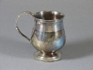A George III silver baluster tankard on a circular spreading foot, London 1823 4ozs, makers mark GK