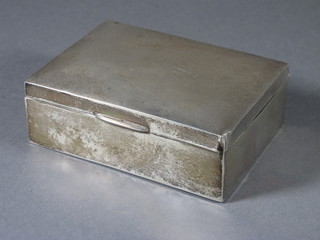 A rectangular plain silver cigarette box with hinged lid Birmingham 1926