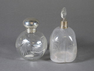 A cut glass dressing table jar and with silver collar and a Dutch  style blown and etched glass perfume bottle with silver collar