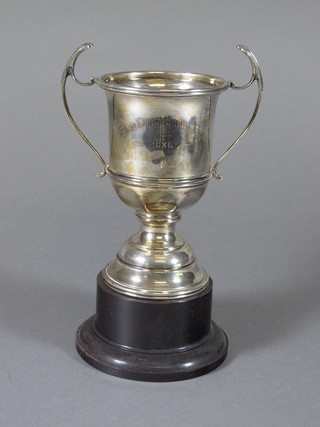 A silver twin handled trophy cup Birmingham 1935 with Jubilee hallmark, raised on a spreading foot, 4ozs