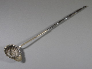 A Dutch silver scallop shaped toddy ladle with whale bone twist  handle