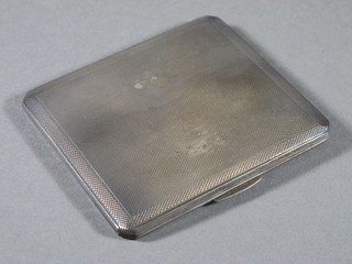 A silver cigarette case with engine turned decoration,  Birmingham 1940, 3ozs
