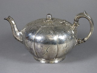 A Victorian engraved melon shaped teapot with armorial  decoration, London 1840, 18ozs