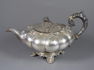A circular silver plated melon shaped teapot