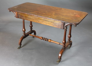 A William IV rectangular rosewood library table raised on  turned supports with H framed stretcher 48"w x 22"d x 28"h