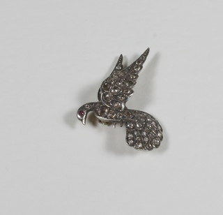 A gold brooch set diamonds in the form of a dove