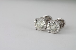 A pair of 18ct white gold ear studs set diamonds, approx 1.40ct