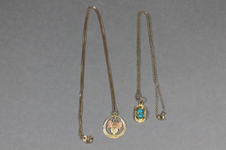 A gilt metal pendant decorated grapes hung on a fine gold chain,  an Eastern gilt metal pendant in the form of a scarab