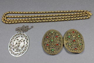 A gilt metal belcher link chain, a carved mother of pearl pendant and a gilt buckle