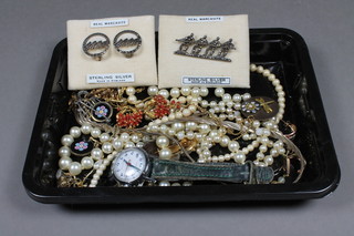 A marcasite brooch, a pair of earrings, a Timex wristwatch and a quantity of costume jewellery