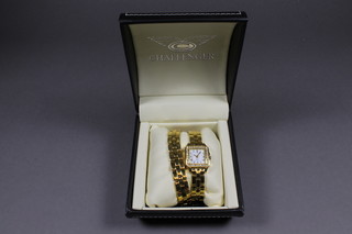A lady's Challenger wristwatch contained in a gold plated case  and a matching bracelet, cased