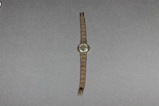 A lady's Omega wristwatch contained in a 9ct gold case with integral bracelet